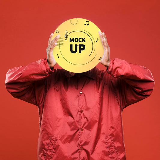 Free Front View Of Man Holding Vinyl Disk Over His Face For Music Store Mock-Up Psd
